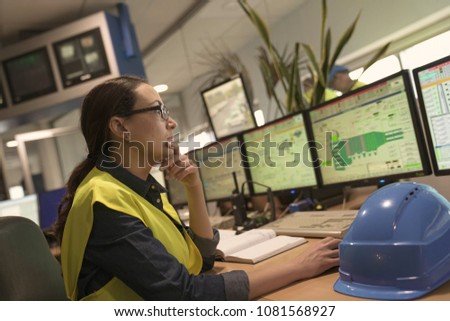 Industrial technician working in monitoring control room