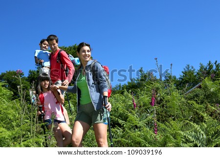 Family on a hiking day going down hill