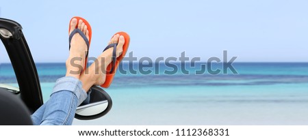 woman\'s feet by convertible car window, template