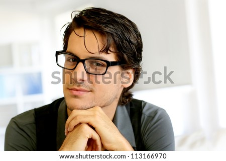 Portrait of handsome young man with glasses