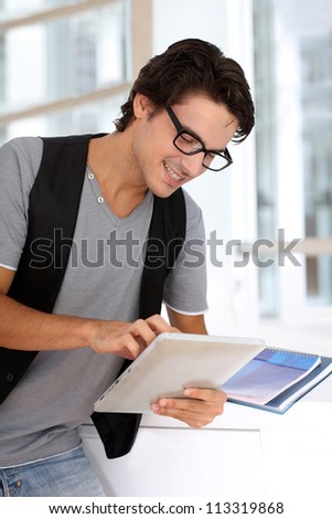 College student using digital tablet at school