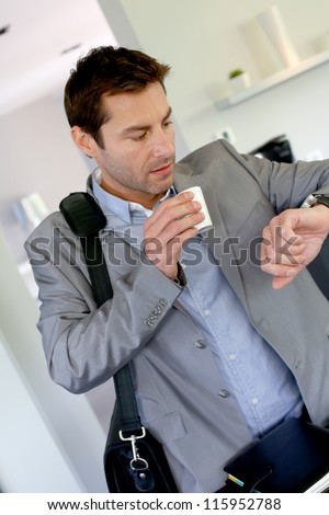 Businessman running late for work