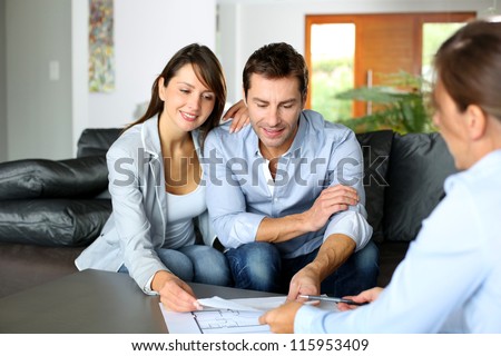 Couple meeting consultant for financial contract Couple meeting consultant for financial contract