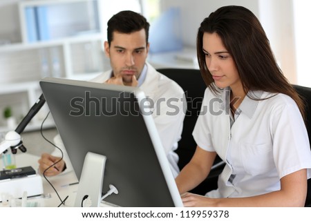 Students working on desktop computer in laboratory