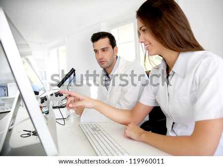 Students working on desktop computer in laboratory