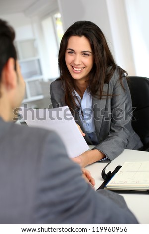 Businesswoman giving job interview