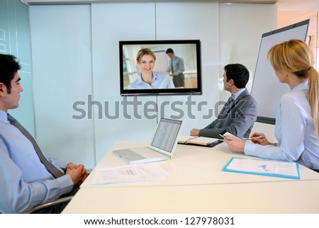 Business People Attending Videoconference Meeting
