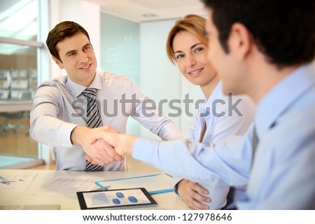 Businessman shaking hand to business partner