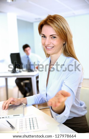 Cheerful businesswoman giving good arguments