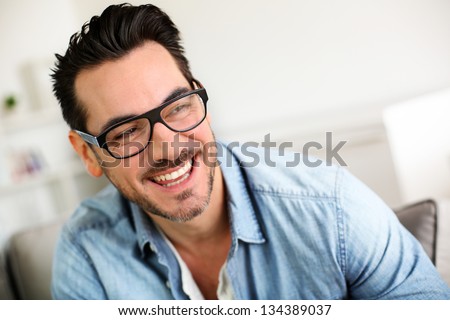 Cheerful Trendy Guy With Black Eyeglasses On