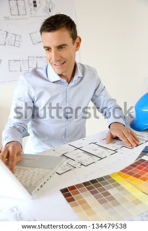 Architect working on laptop computer