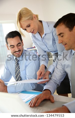 Corporate woman presenting results to sales team
