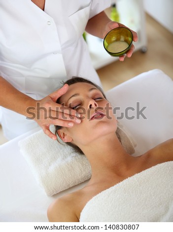 Woman receiving a face massage