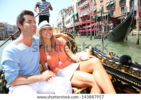 Couple In Venice Having A Gondola Ride On Canal Grande