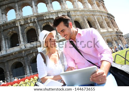 Couple in Rome using tablet to get tourist information