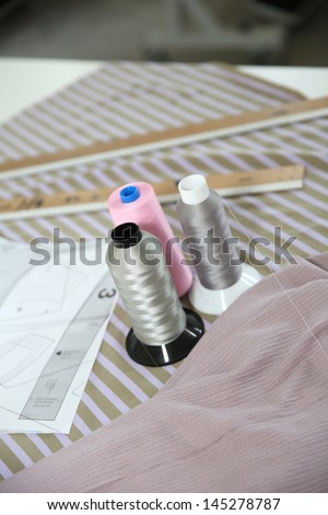 Closeup of dressmaking tools set on table