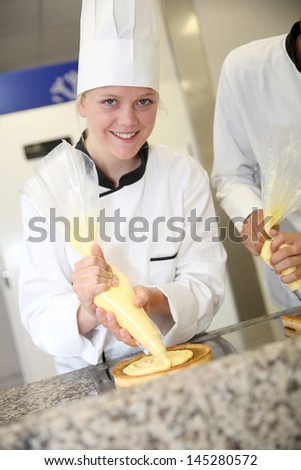 Portrait of pastry cook student girl