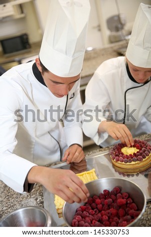 Students in training class making French pastry