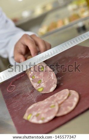 Closeup of pork sausage being cut