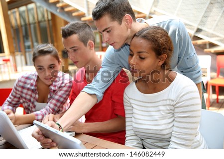 Young people connected on internet in college campus