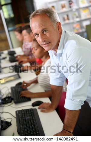 Portrait of computing teacher in classroom