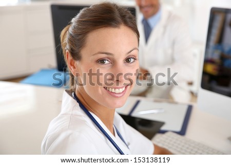Beautiful nurse working in hospital office