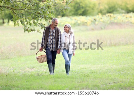 Senior couple walking in countryside
