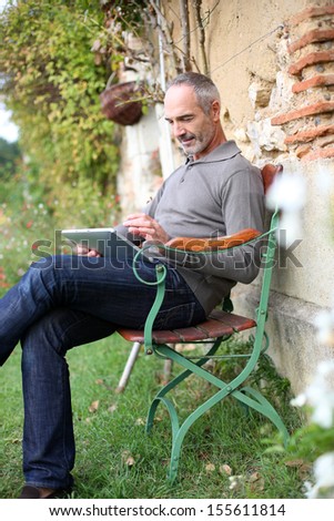 Man relaxing in country house on week-end