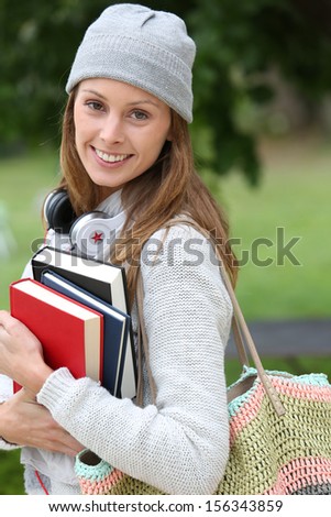 College student walking in park