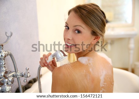 Beautiful Woman Showering In Bathtub