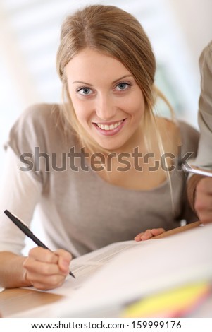 Girl filling application form for business school