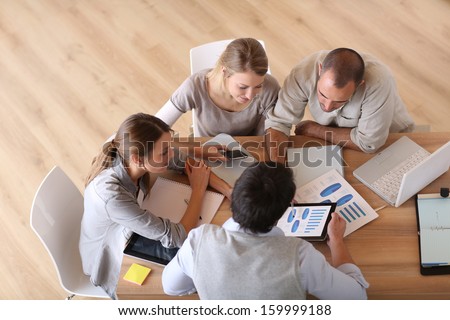 Upper View Of Business People Around Table