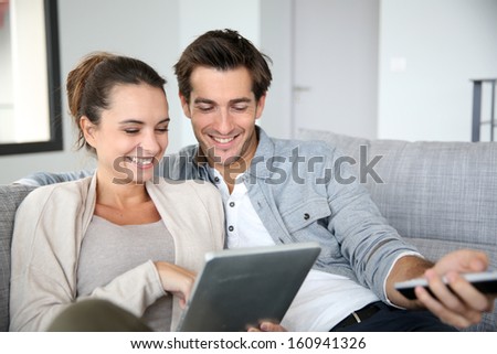 Couple Looking For Tv Program On Internet