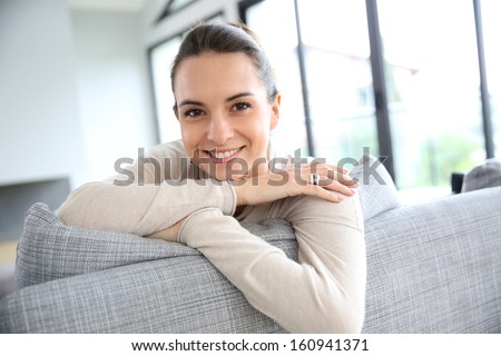 Gorgeous woman at home relaxing in living-room
