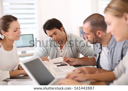 College people studying together in school lounge