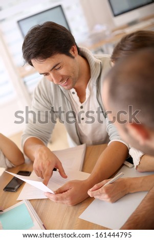 Group of business people in office working on project