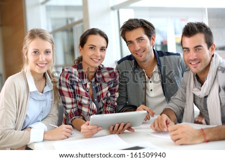 Young People Meeting With Digital Tablet