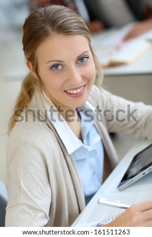 College girl studying with digital tablet