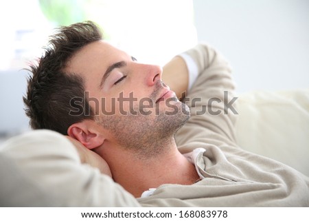Man taking a nap in sofa