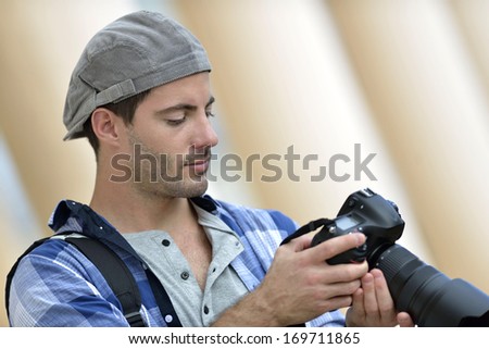 Portrait of photographer looking at screen