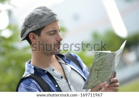 Adventurer looking at street map