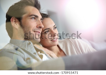 Couple At Home Relaxing In Sofa