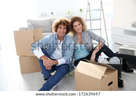 Couple getting in their new apartment to live together