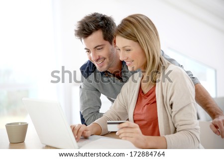Couple at home buying on internet