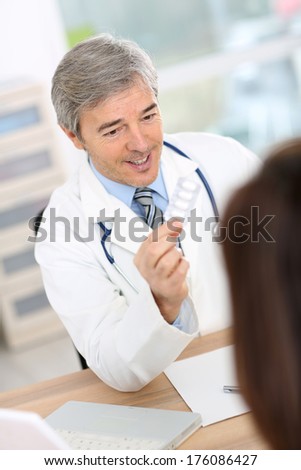 Doctor with patient in consultation room