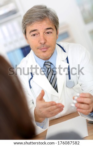 Doctor with patient in consultation room