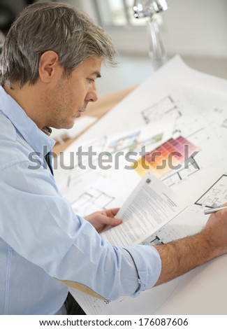 Architect working on construction project in office
