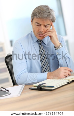 Businessman with worried expression on his face