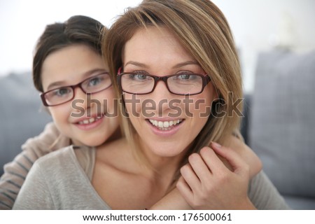 Portrait of mother and daughter with eyeglasses Portrait of mother and daughter with eyeglasses