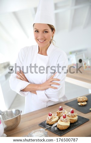 Successful woman confectioner in professional kitchen